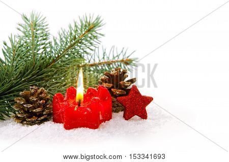 Christmas background with red advent candle and green fir tree bransh .Christmas decoration.
