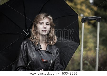 Girl With The Black Umbrella In Autumn Day