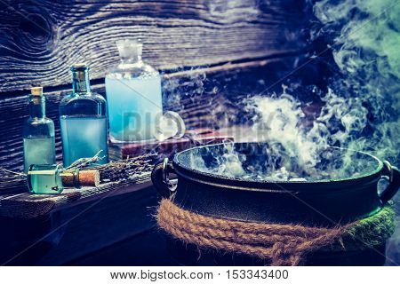 Old Witch Pot With Blue Potions For Halloween