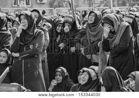 Istanbul Turkey - October 11 2016: Shia Muslim women mourn during an Ashura. Turkish Shia Muslims mourning for Imam Hussain. Caferis take part in a mourning procession marking the day of Ashura in Istanbul's Kucukcekmece district Turkey on October 11 2016