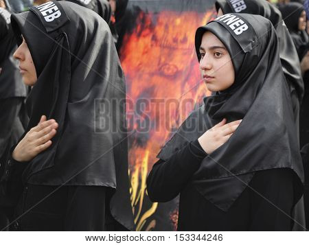 Istanbul Turkey - October 11 2016: Turkish Shia girls takes part in an Ashura parade in Istanbul's district of Kucukcekmece. Turkish Shia Muslims mourning for Imam Hussain. Caferis take part in a mourning procession marking the day of Ashura in Istanbul's