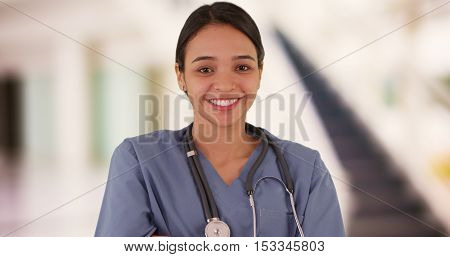 Happy Mexican woman nurse smiling at camera
