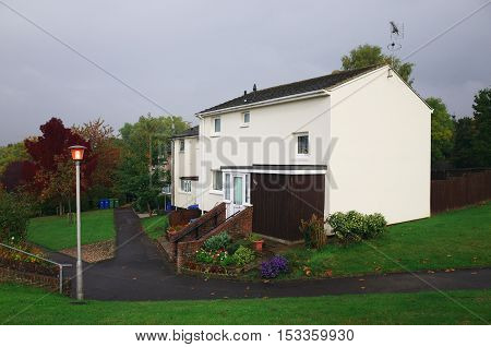 Bracknell,England - October 25, 2016: Homes on a housing estate in Bracknell, England after a shower of rain on a grey day. Typically, estates in the area are a mixture of private and social housing
