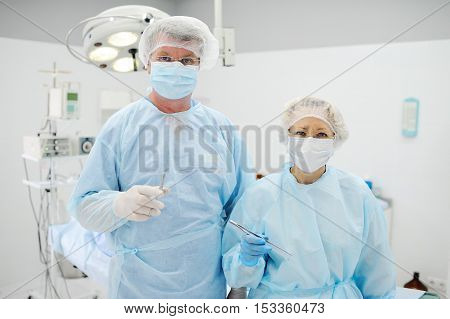 surgeons operate on a patient in the background Surgical Lamp
