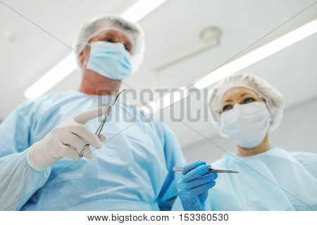 surgeons operate on a patient in the background Surgical Lamp