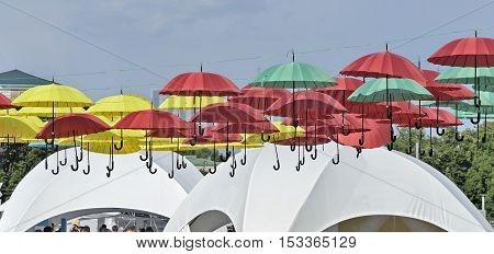 Dangling versicolor color parasols on Sofievska square at the time of Celebrating the Day of Kyiv 05-31-2015