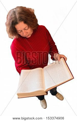 Woman in red sweater holding a large open book in his hands. A woman stands on the white background isolated