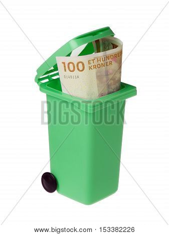 One undred Dannish kroner banknote inside an opened green recycling bin isolated on white background.