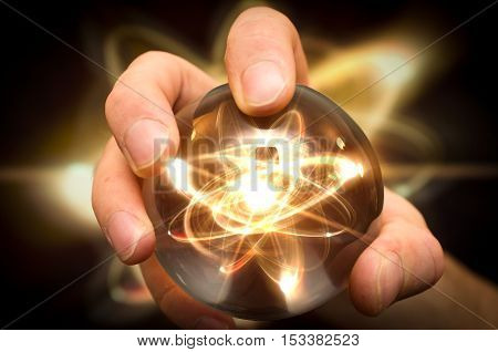 Holding atom in fortune teller magic crystal ball