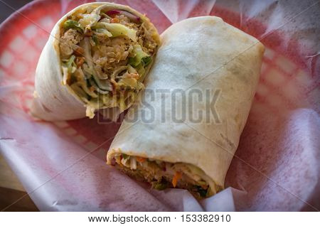 Korean fast food Bibimbap burrito with spicy kimchi