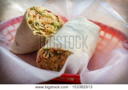 Korean fast food Bibimbap burrito with spicy kimchi