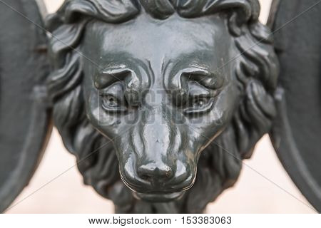 Iron antique lion head: design the gate with the heads of lions at the Museum Derzhavin Palace in Saint-Petersburg.