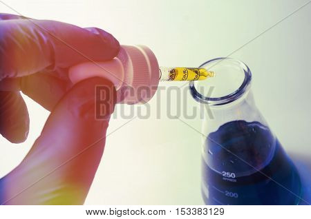 Close up glass measuring beaker for science experiment background