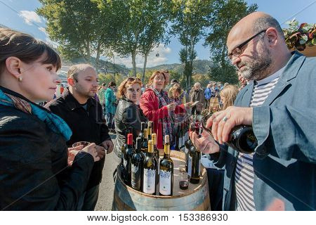TBILISI, GEORGIA - OCT 16, 2016: People tasting wine at stores of the private wine companies during festival Tbilisoba on October 16, 2016. Tbilisoba is traditional festival in capital of Georgia from 1979