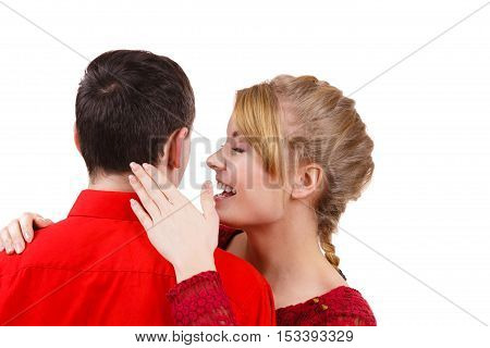 Woman telling man some secrets couple talking gossiping. Excited emotional girl whispering to boyfriend ear