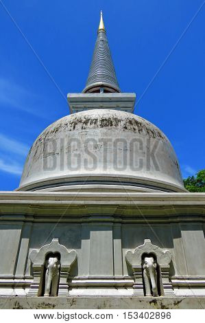Rock pagoda on eleplant head image in bright sky at Muangboran the ancient city,Thailand.(Srivichaya culture pattern of pagoda ,Thailand.)