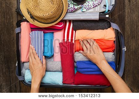 woman packing luggage for a new journey