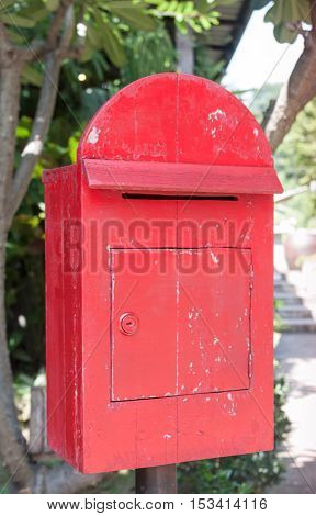 Old wooden red post box, stock photo