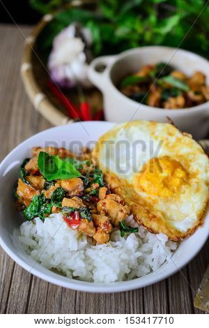 Kapro Gai Kai Dao, Stir Fried Basil Cicken on wooden Thai Famous Food Thai Street Food Thai Cuisine Thai Spicy Food