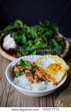 Kapro Gai Kai Dao, Stir Fried Basil Cicken on wooden Thai Famous Food Thai Street Food Thai Cuisine Thai Spicy Food