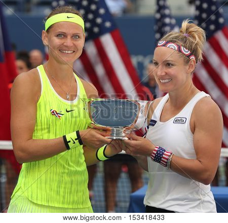 NEW YORK - SEPTEMBER 11, 2016: US Open 2016 women doubles champions  Lucie Safarova (L) of Czech Republic and Bethanie Mattek-Sands of United States during trophy presentation in New York