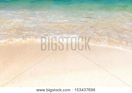 Wave of blue ocean on sandy beach. Background.
