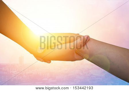 Closeup hands Used to help each other on background. The concept of Business. hands strong who have experience to help the people who are able to move on to greatness.two hold love team work office.