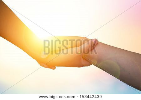 Closeup hands Used to help each other on background. The concept of Business. hands strong who have experience to help the people who are able to move on to greatness.two hold love team work office.