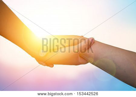 Closeup hands Used to help each other on background. The concept of Business. hands strong who have experience to help the people who are able to move on to greatness.two hold love team work office.