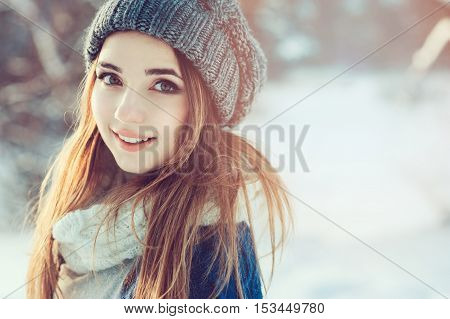 beautiful young woman relaxing on winter walk in snowy forest candid capture lifestyle scene