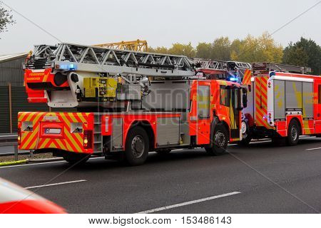 HANNOVER / GERMANY - OCTOBER 25 2016: german firefighting trucks stands on freeway a2 by a truck crash near Hannover.