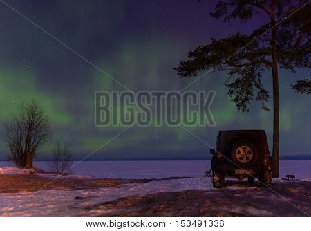 Leningrad Oblast, Russia, February 16, 2016. Jeep Wrangler on the shore of Lake Ladoga, the Jeep Wrangler is a compact four wheel drive off road and sport utility vehicle