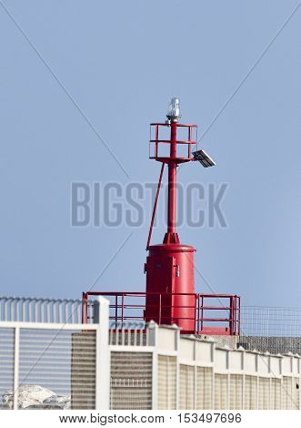 detail of red light nouse in marina di carrara harbour