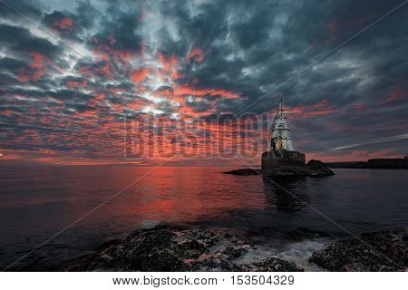 Magnificent cloudy sunrise at the Lighthouse, Ahtopol, Bulgaria