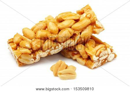 Bars with peanuts isolated close-up on white background.