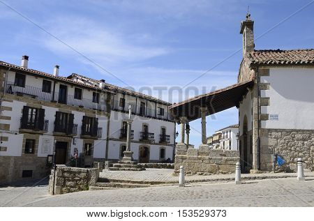 CANDELARIO, SPAIN - AUGUST 11, 2016: Hermitage and Cross in a plaza in Candelario a typical mountain village in the province of Salamanca Spain.