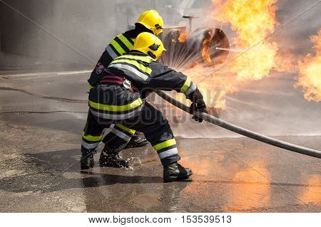 Firefighters attack propane fire during training exercise