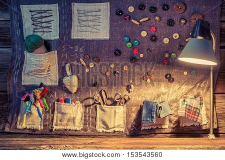 Sewing Cloth With Scissors, Threads And Needles In Tailor Workshop