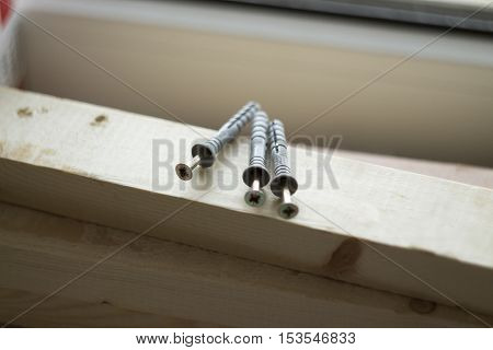 the dowels lying on a wooden Board