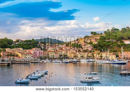 Panoramic view over the famous town Porto Azzurro at sunset, in Elba island, Italy