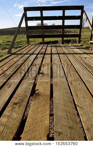 Wooden floor of a hayrack for hauling straw and hat bales