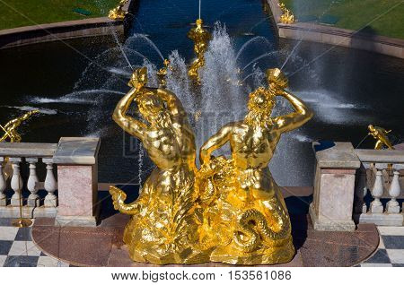 PETERHOF, RUSSIA - MAY 26, 2015: Triton, Samson Fountain, the Grand Cascade of Peterhof and Sea Channel. Peterhof Palace included in the UNESCO World Heritage List. Petergof, Saint Petersburg, Russia