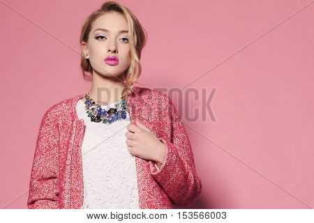 fashion studio photo of gorgeous young woman with blond hair in elegant clothes with acccessories