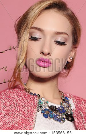 fashion studio photo of gorgeous young woman with blond hair in elegant clothes with acccessories