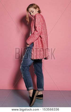 fashion studio photo of gorgeous young woman with blond hair in elegant clothes with acccessories