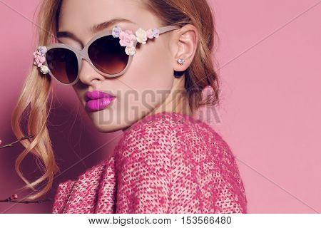 fashion studio photo of gorgeous young woman with blond hair in elegant clothes with acccessories
