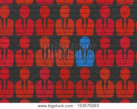 Finance concept: rows of Painted red business man icons around blue business man icon on Black Brick wall background