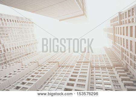 Contemporary white and grey residential skyscraper apartment building in Moscow on a bright day view from bottom