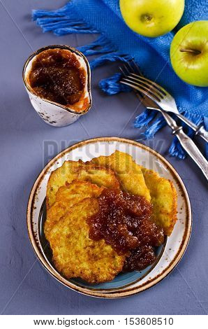 Traditional potato pancakes with apple jam. Selective focus.