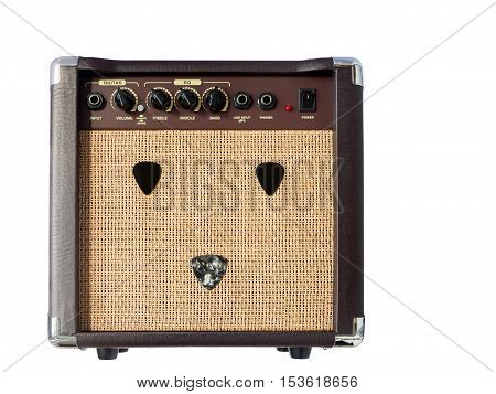 Small acoustic guitar amplifier with pick guitar on amplifier mask isolated on white background
